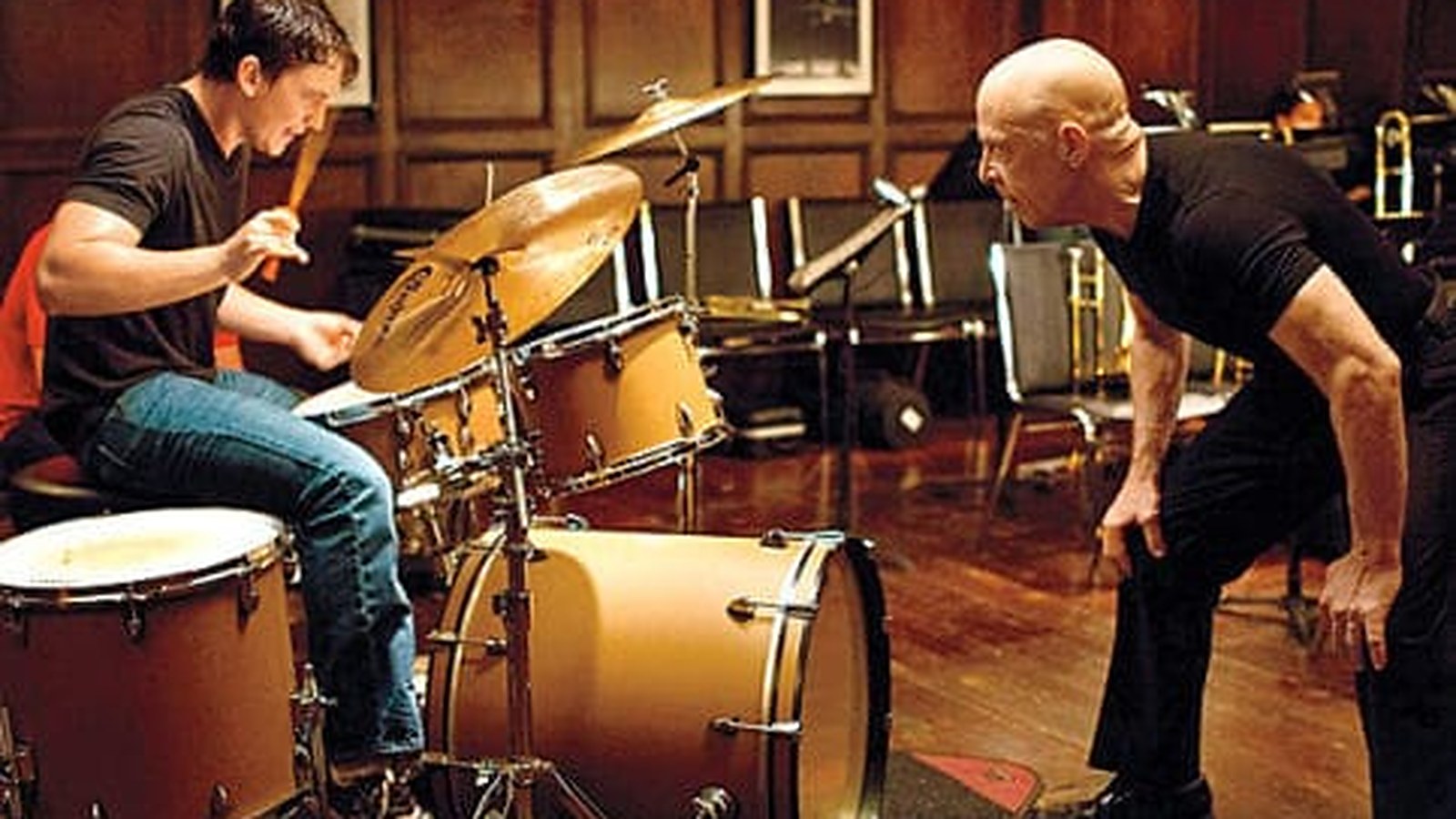 Andrew at the drum kit while Fletcher leans in close to scream &mdash; the rehearsal scene from Whiplash (2014). The masterclass in refusing to round up to a good effort.